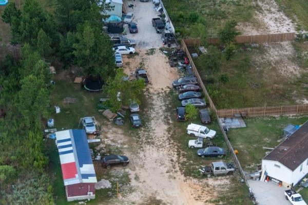 An aerial view of apparently scrap cars in co<em></em>lony Ridge