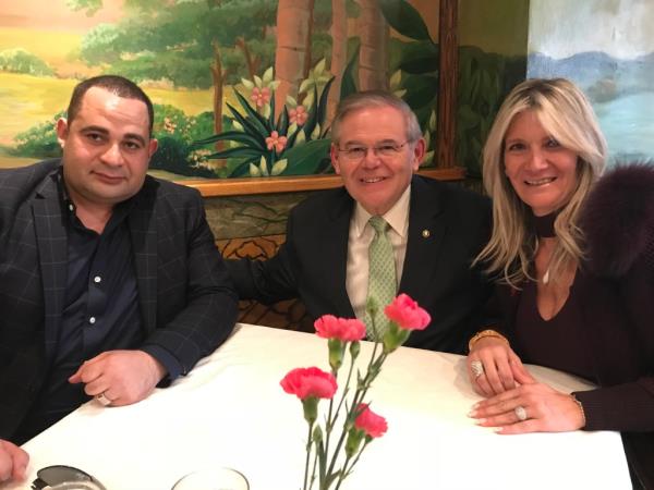 Wael Hana along with the Menendez family. 