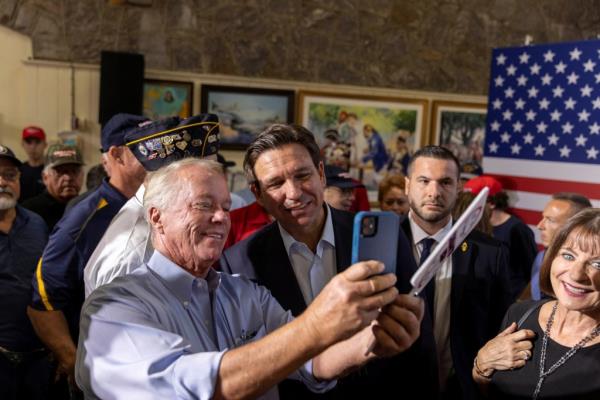 DeSantis takes a picture with an attendee during his campaign stop in South Carolina.
