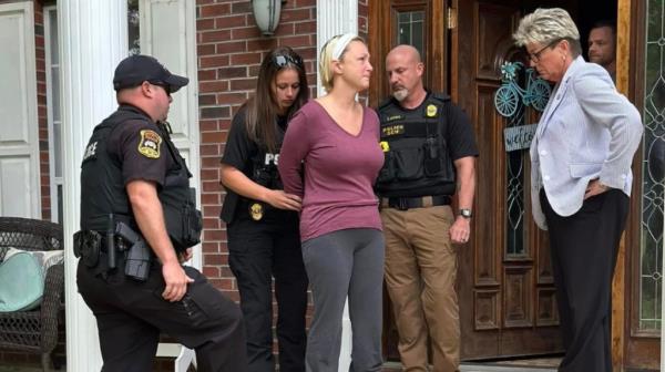 Alissa McCommon being arrested at he home.